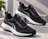 Black men's gym and running shoes with white cushioned sole